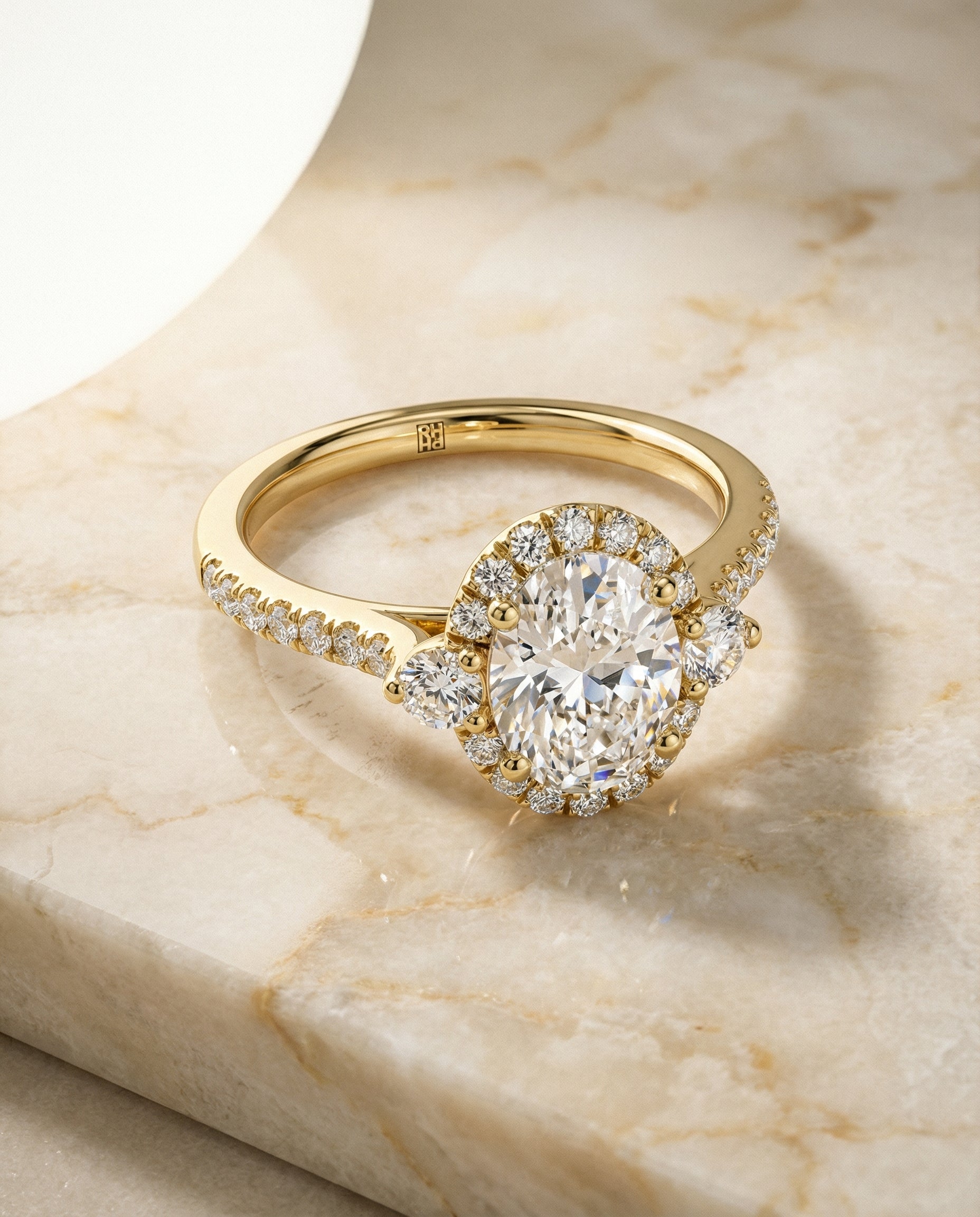 Ivy Select Three Stone Delicate Halo Ov Oval Lab Diamond Engagement Ring in 18K Yellow Gold, alternate angle | RockHer