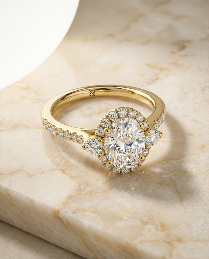 Ivy Select Three Stone Delicate Halo Oval Lab Diamond Engagement Ring in 14K Yellow Gold, alternate angle | RockHer