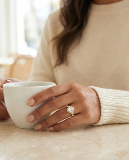 Three Stone Delicate Halo Oval, in 18K Yellow Gold – lifestyle shot | RockHer