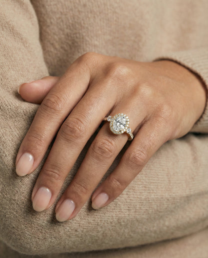 Ivy Select Three Stone Delicate Halo Oval Lab Diamond Engagement Ring in 14K Yellow Gold, shown on hand | RockHer