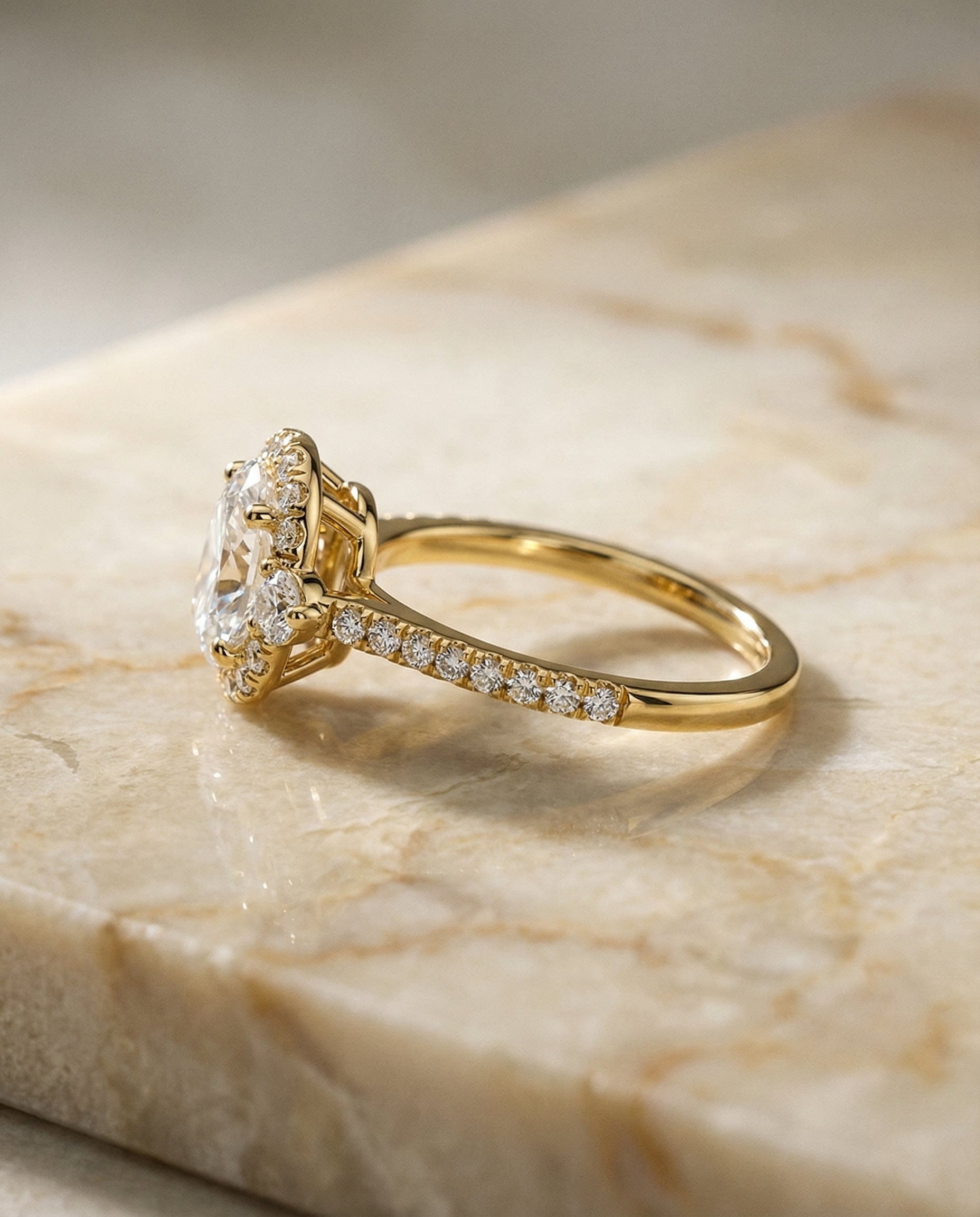 The Ivy three stone delicate halo engagement ring setting, shown in 18K Yellow Gold | RockHer