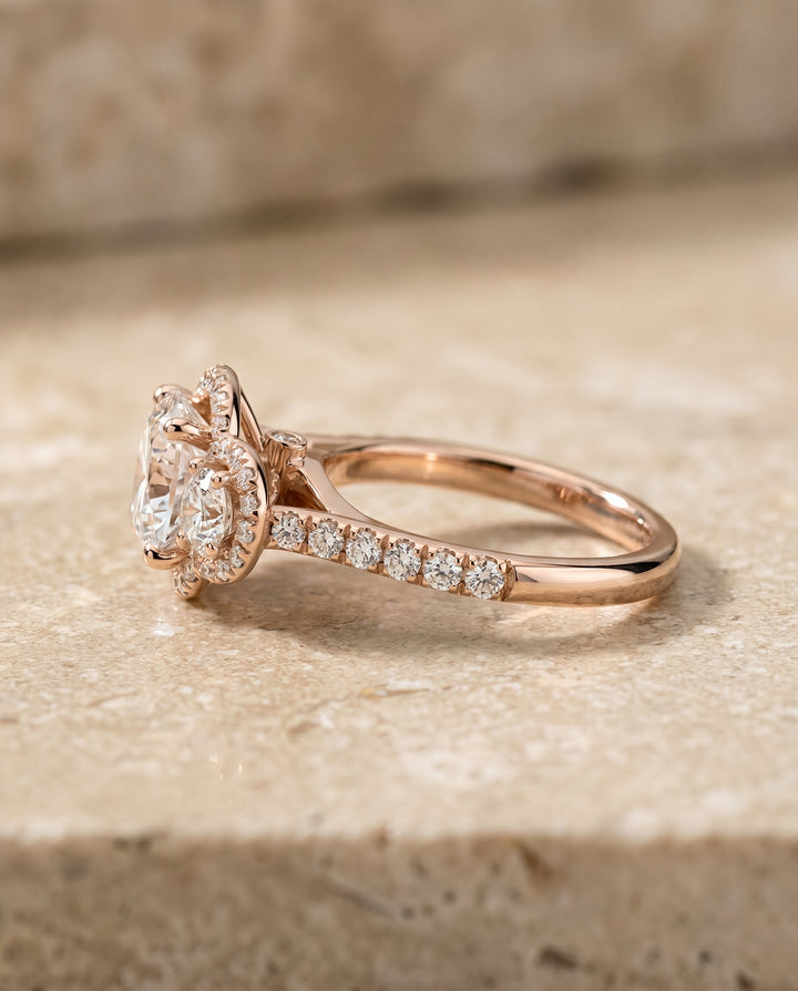 Round Brilliant, Three Stone Halo, in 14K Rose Gold, pave setting – side profile | RockHer
