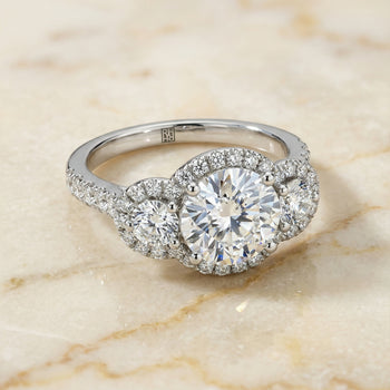 The Andrea Three Stone Halo Round Engagement Ring Setting in Platinum