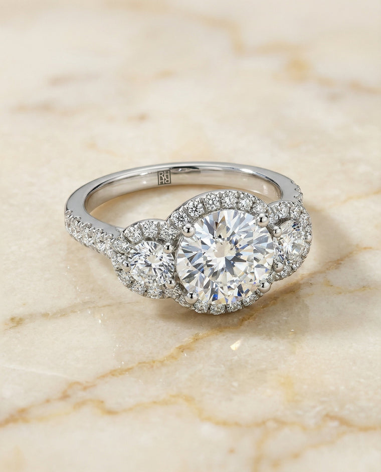 The Andrea Select Three Stone Halo Round Lab Diamond Engagement Ring in Platinum