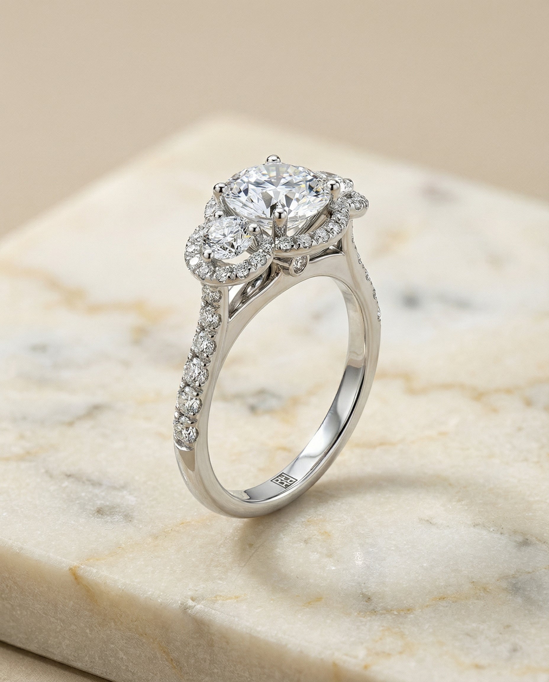 Three Stone Halo styling on The Andrea round engagement ring setting | RockHer