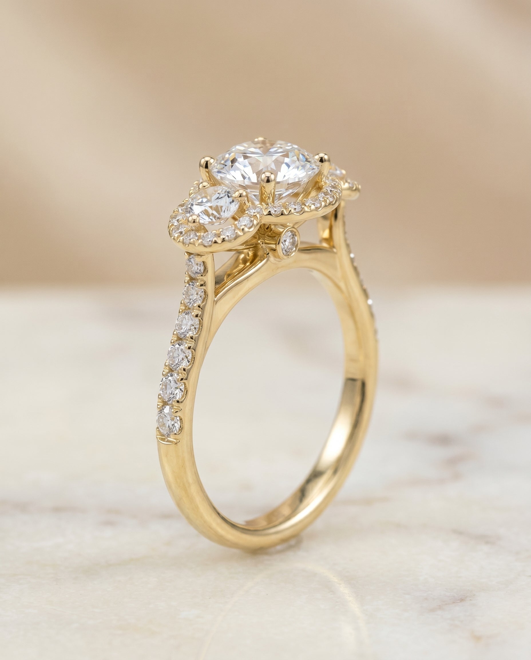 Round Brilliant, Three Stone Halo, in 18K Yellow Gold, pave setting – front view | RockHer
