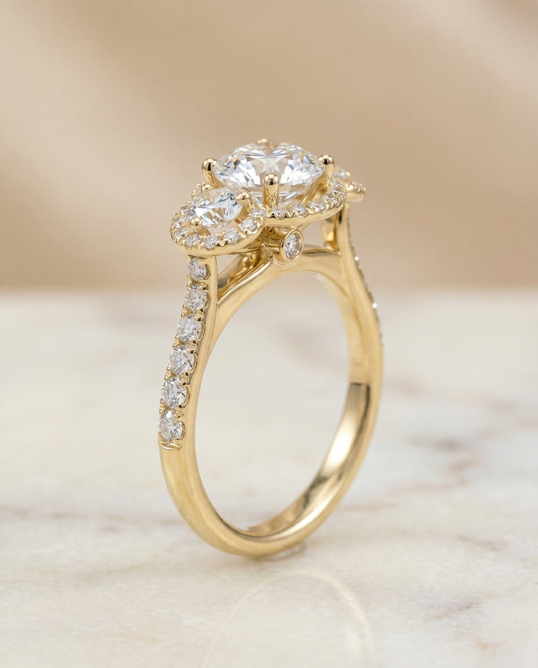 The Andrea Select Three Stone Halo Round Lab Diamond Engagement Ring in 18K Yellow Gold