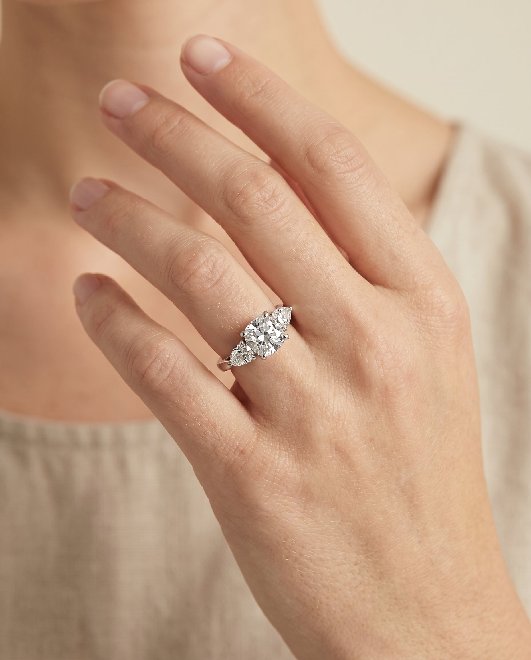 Angelica Select Three Stone Matched Cushion Cut Lab Diamond Engagement Ring in 18K White Gold, shown on hand | RockHer