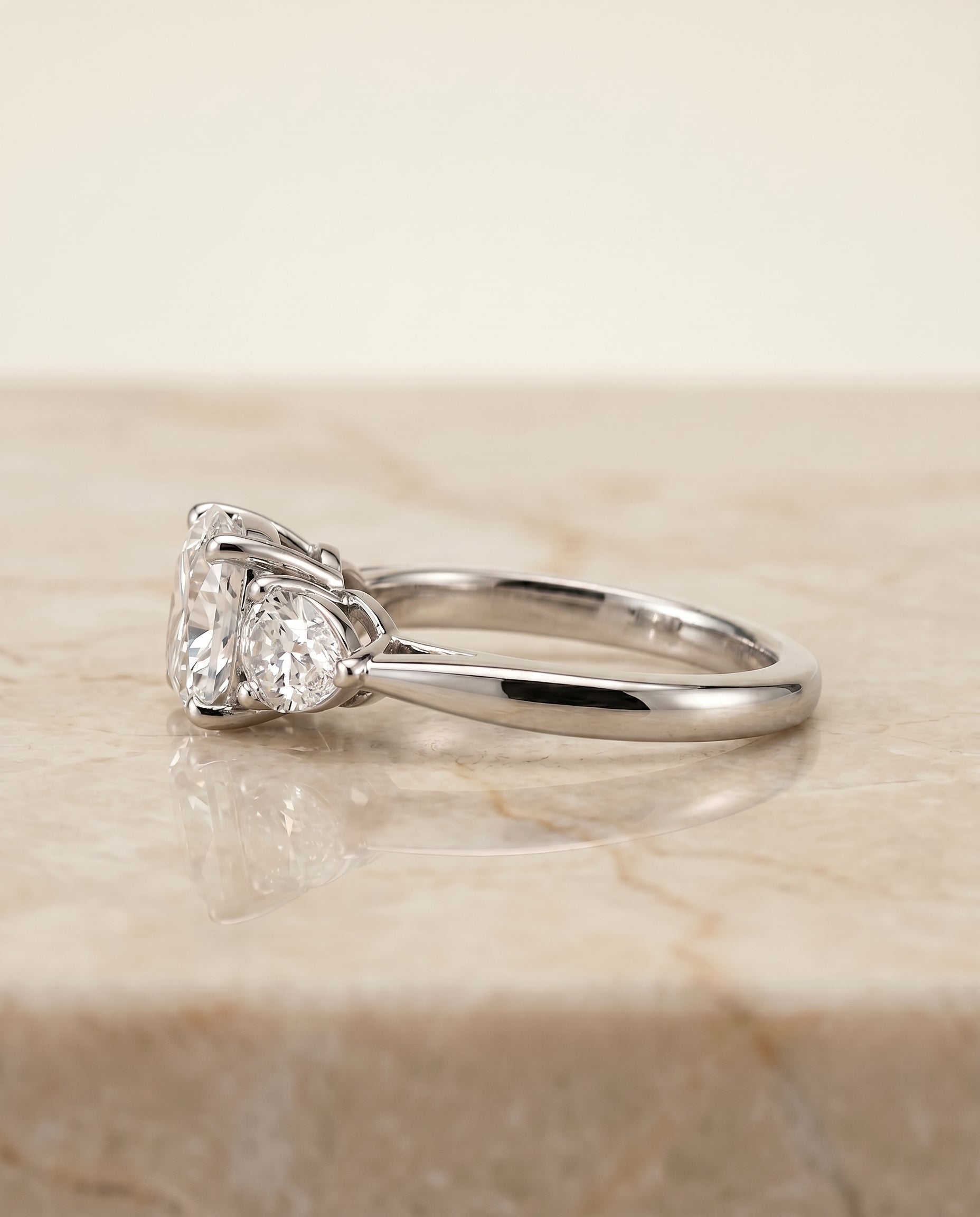 Angelica Select Three Stone Matched Cushion Cut Lab Diamond Engagement Ring in 18K White Gold, side view | RockHer