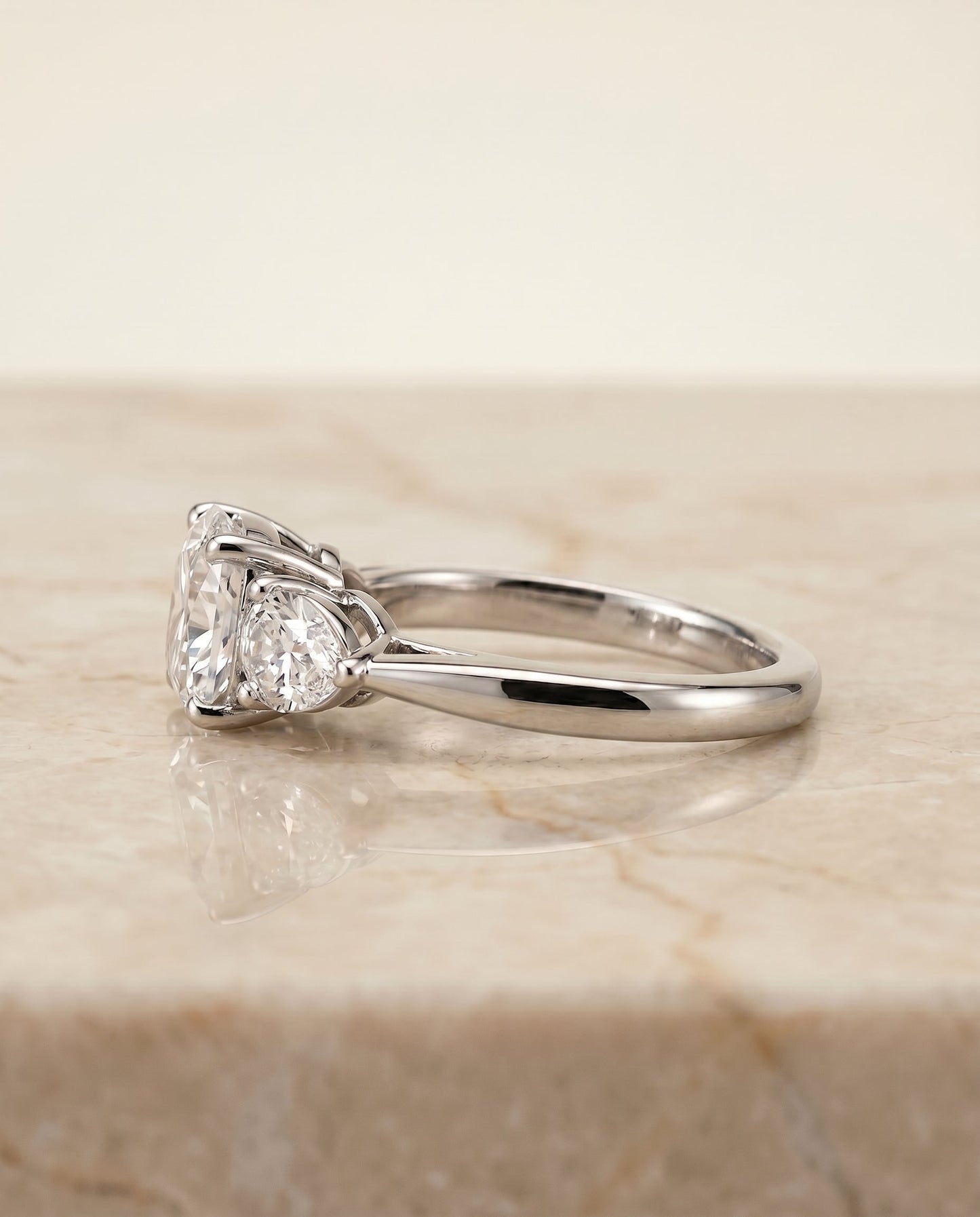 Angelica Select Three Stone Matched Cushion Cut Lab Diamond Engagement Ring in Platinum, side view | RockHer