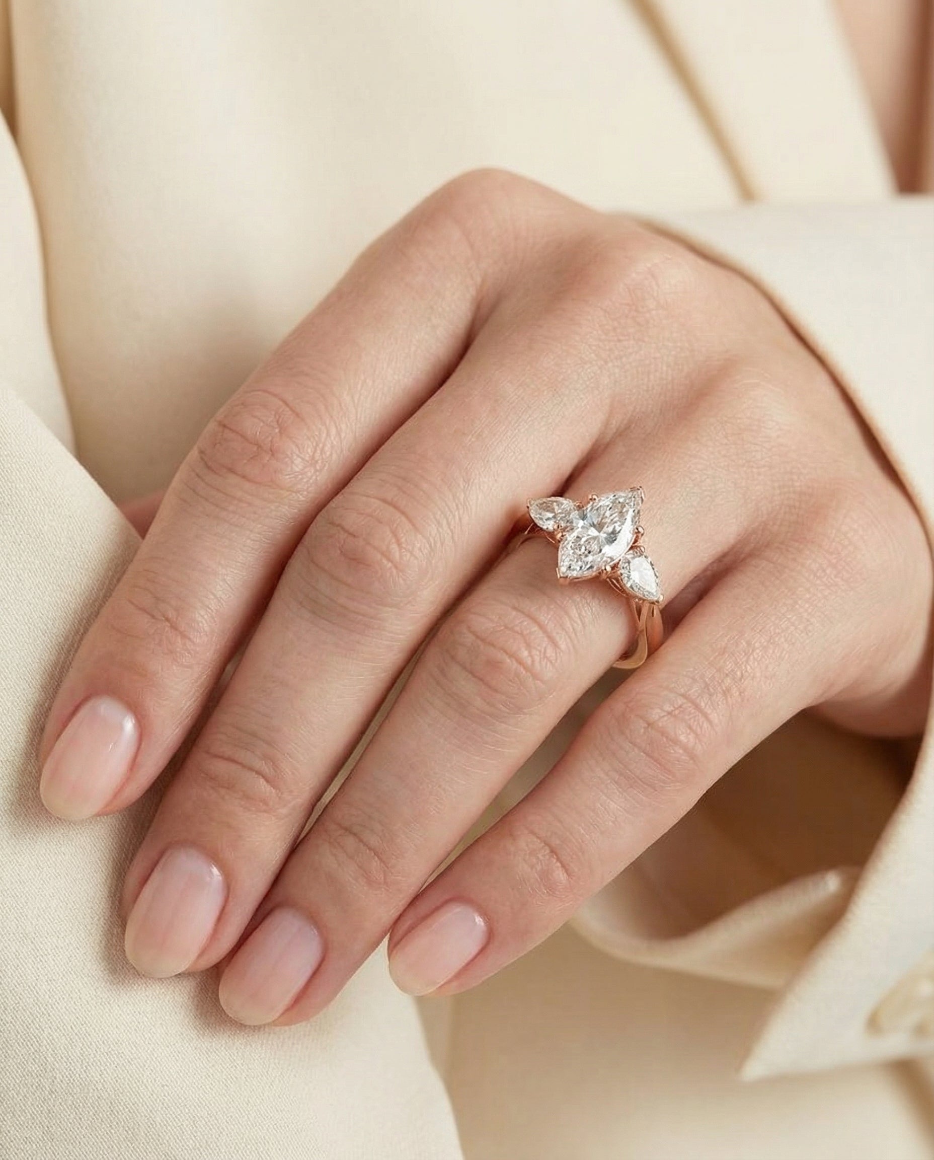 Angelica Select Three Stone Matched Marquise Lab Diamond Engagement Ring in 14K Rose Gold, shown on hand, angled | RockHer