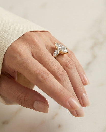 Angelica Select three stone matched shape marquise marquise ring in 14K Yellow Gold — on hand angled — RockHer