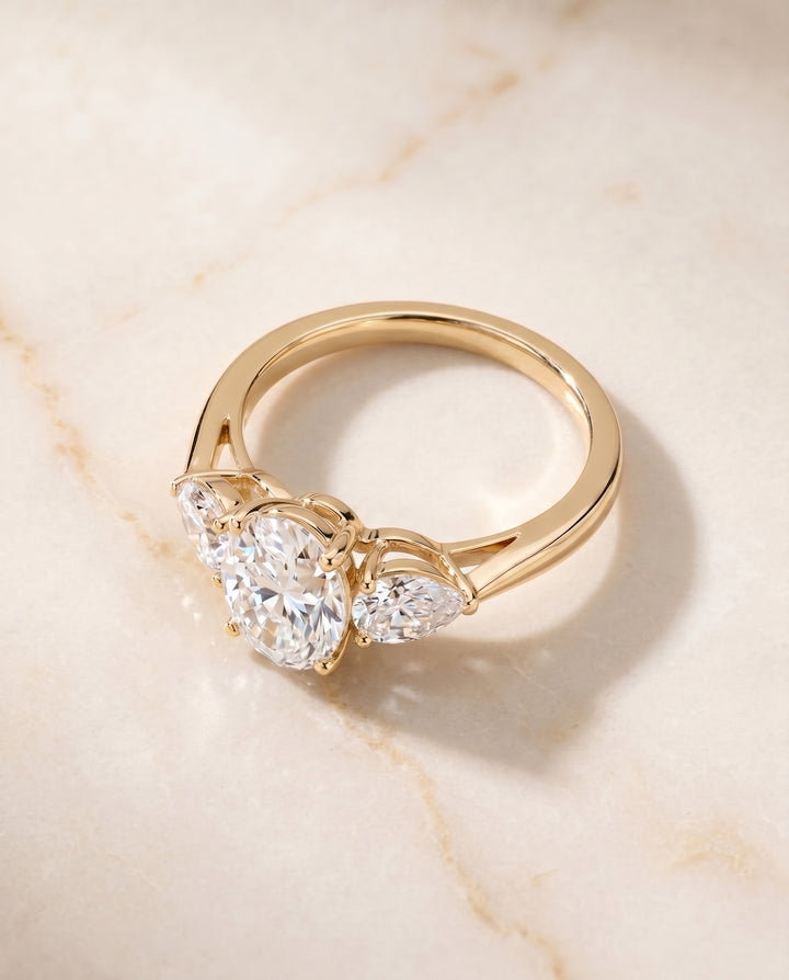 The Angelica Three Stone Engagement Ring Setting for Oval Diamonds in 18K Yellow Gold
