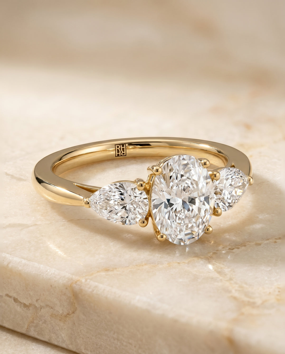 The Angelica Three Stone Engagement Ring Setting for Oval Diamonds in 18K Yellow Gold | RockHer