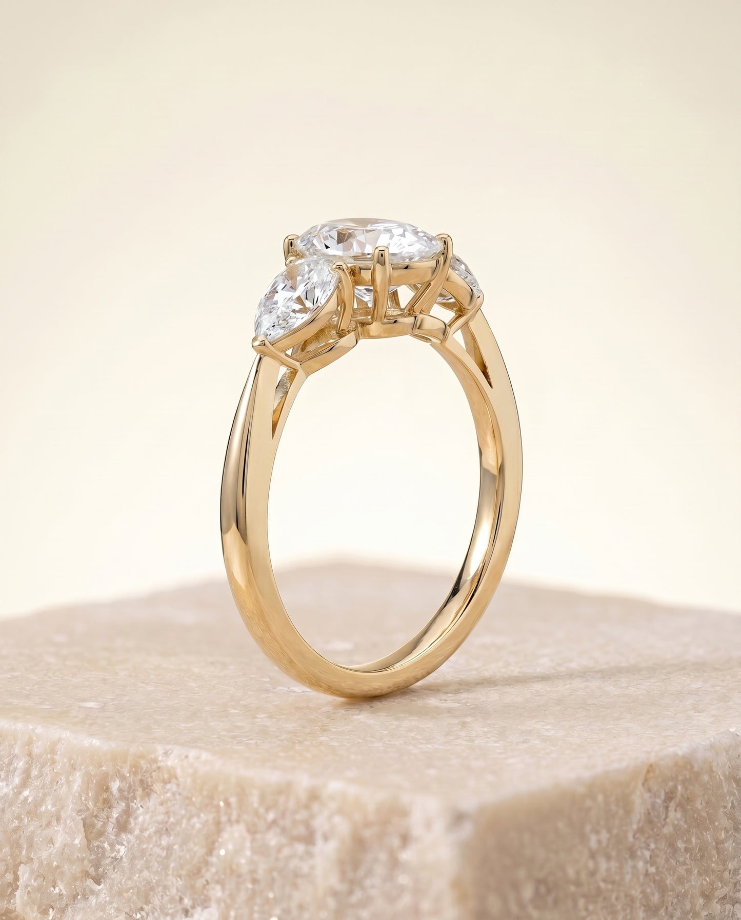 The Angelica Three Stone Engagement Ring Setting for Oval Diamonds in 18K Yellow Gold