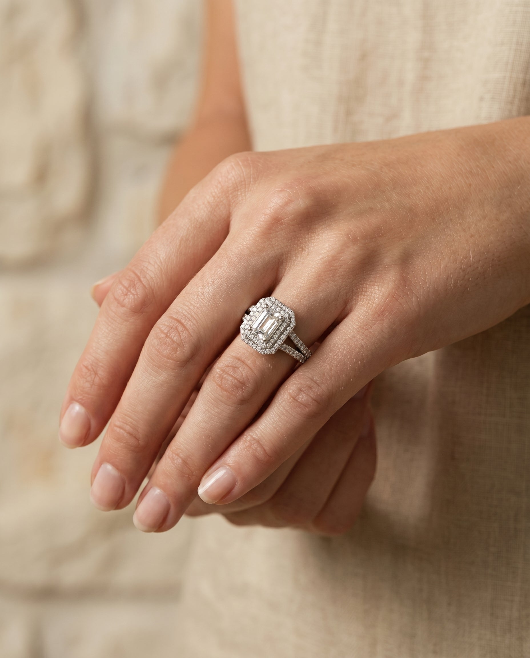Mariah Select Three Tier Halo Crown Emerald Cut Lab Diamond Engagement Ring in 18K White Gold, shown on hand | RockHer