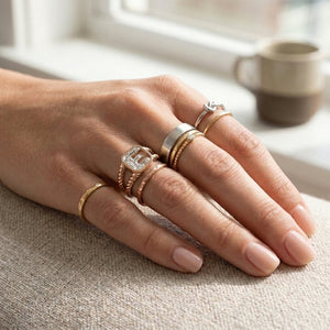 Women's Twisted Band lab-grown diamond letter signet ring in 14K Rose Gold, letter E, worn on hand