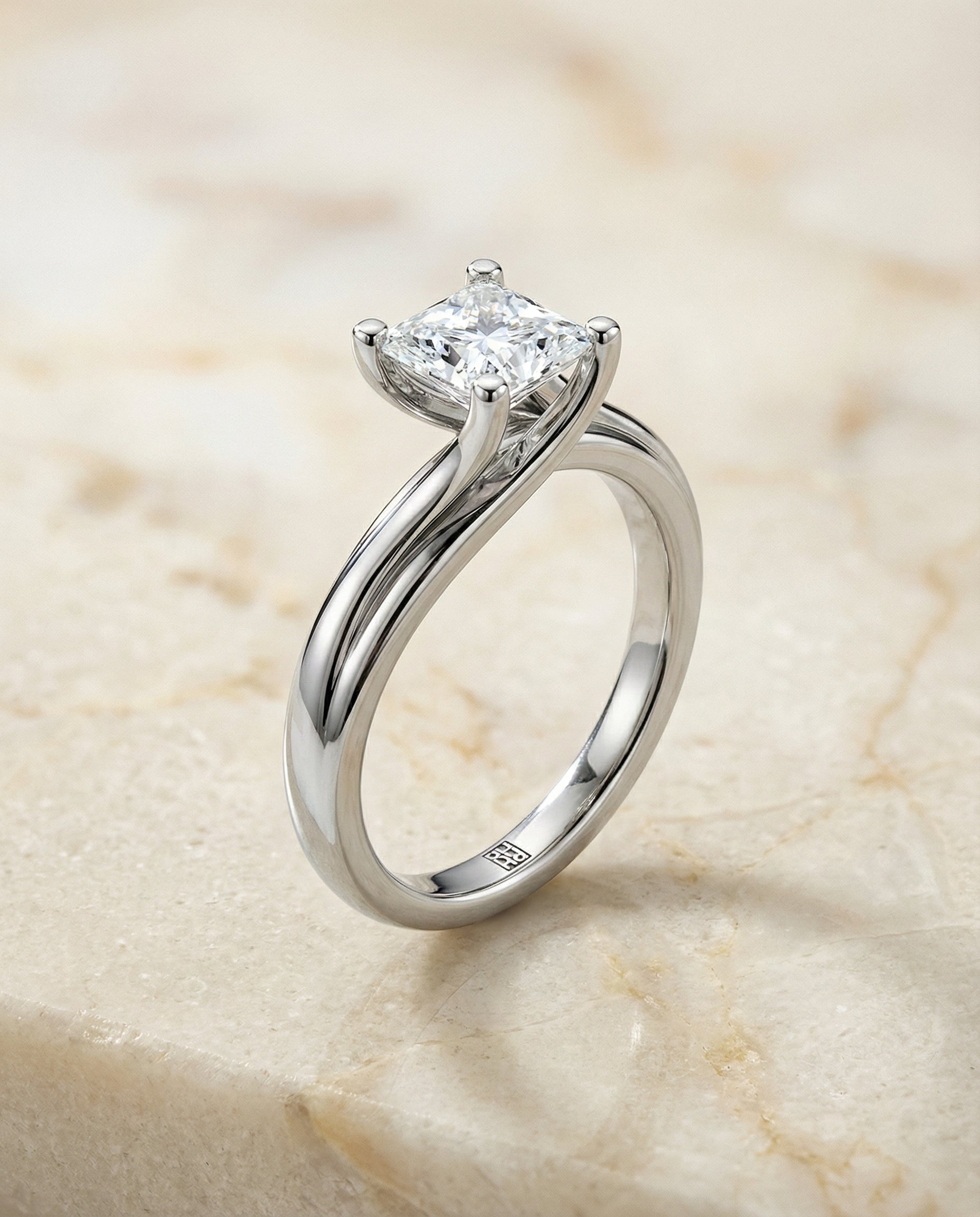 The Joplin twisted bypass solitaire engagement ring setting, shown in 18K White Gold | RockHer