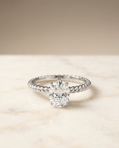 Oval, Twisted Rope Surprise Stone Solitaire, in 18K White Gold – angled view | RockHer