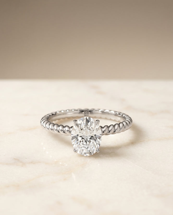 Oval, Twisted Rope Surprise Stone Solitaire, in 18K White Gold – angled view | RockHer