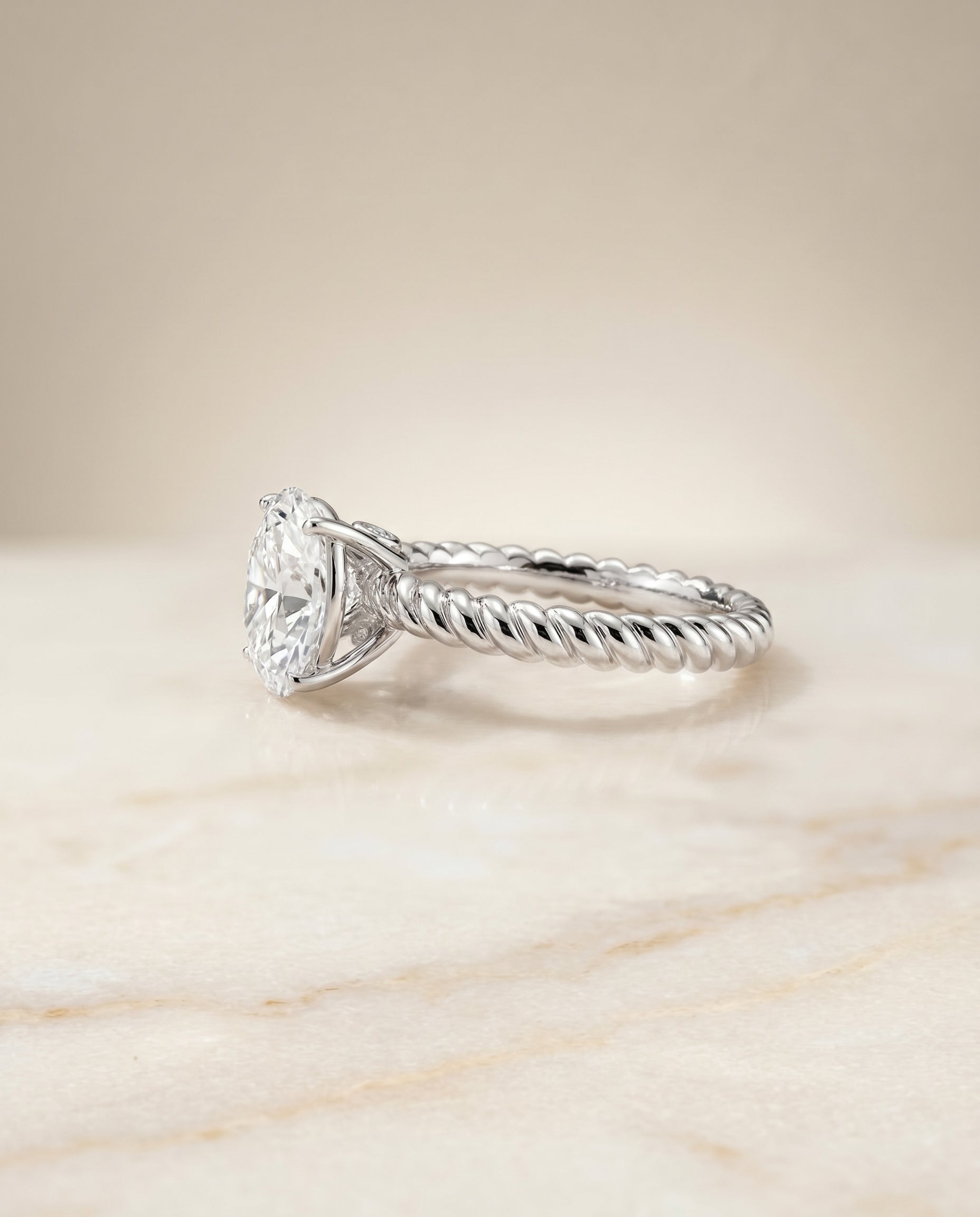 The Charlie twisted rope surprise diamond solitaire engagement ring setting, shown in 18K White Gold | RockHer