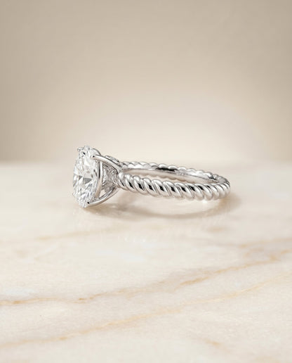 Charlie Select Twisted Rope Surprise Stone Solitaire Ov Oval Lab Diamond Engagement Ring in Platinum, side view | RockHer