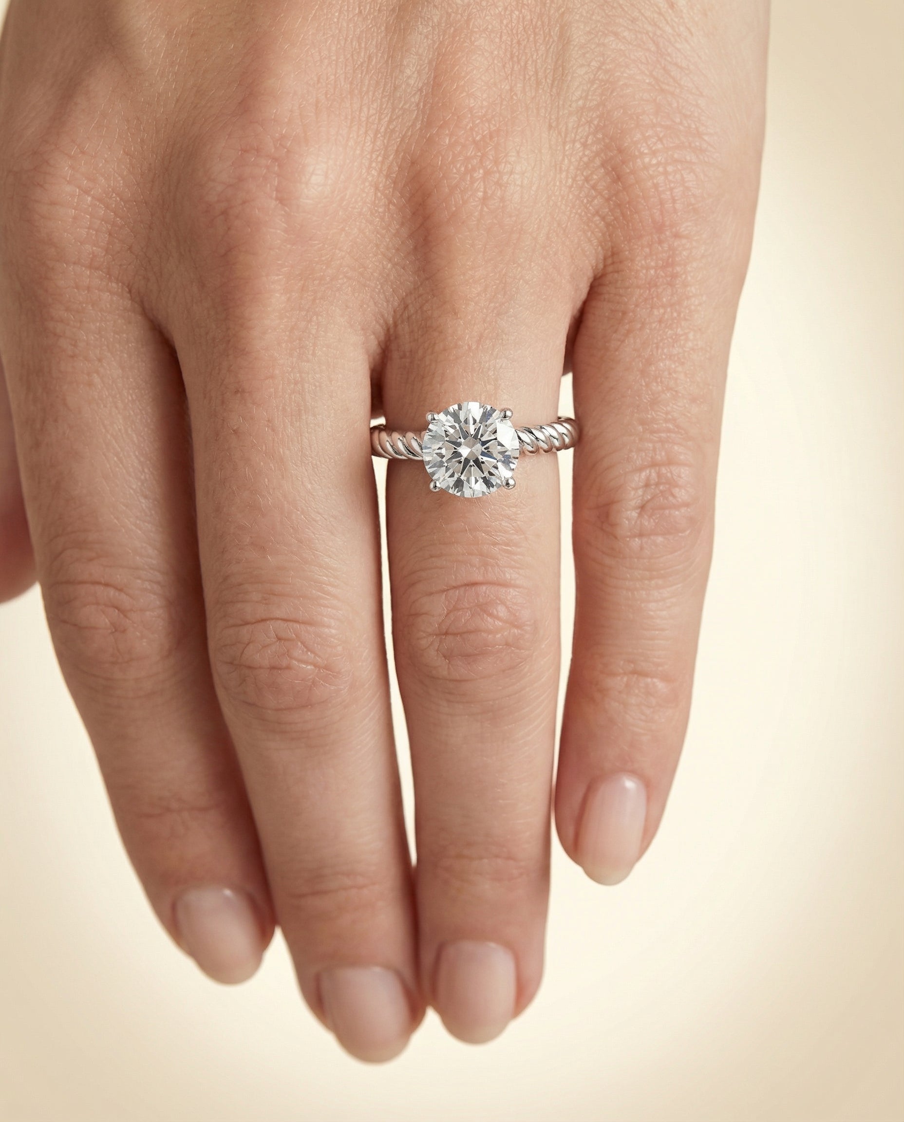 The Charlie engagement ring setting in Platinum, twisted rope surprise diamond solitaire design | RockHer