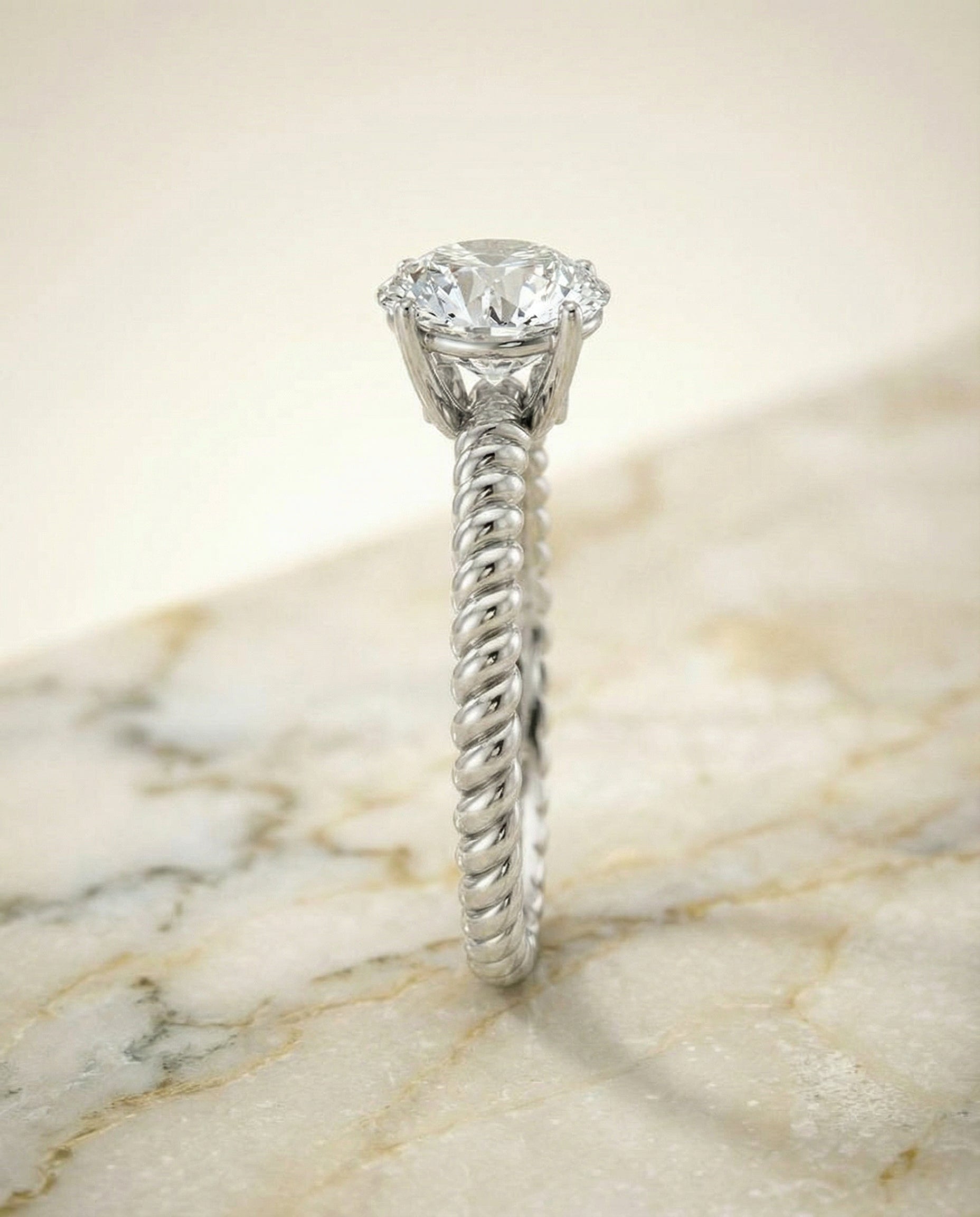 The Charlie twisted rope surprise diamond solitaire engagement ring setting, shown in Platinum | RockHer