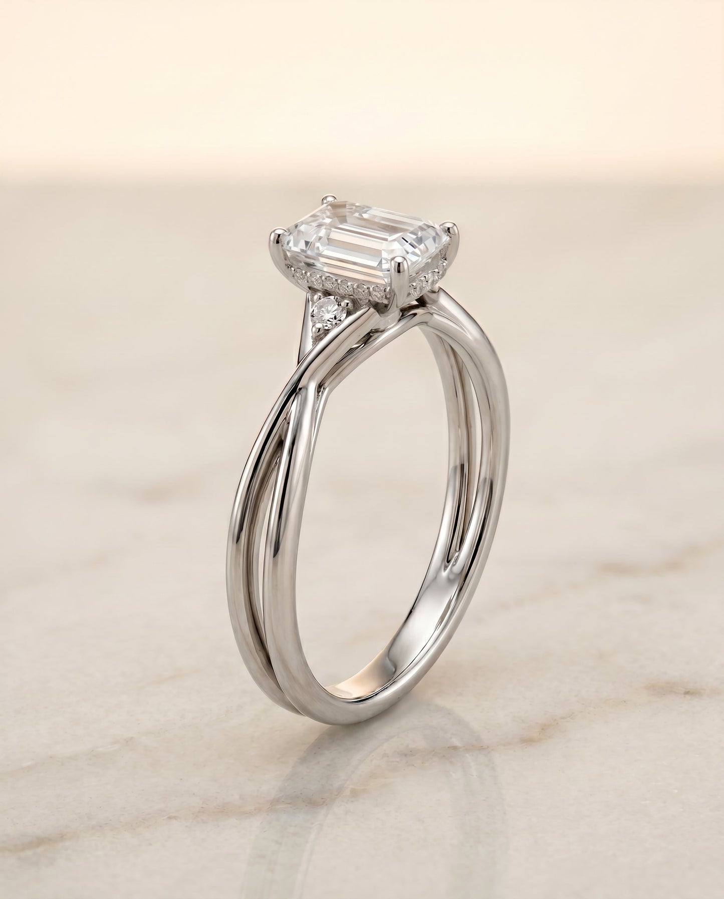 The Dusty Select Twisted Shank Hidden Halo Solitaire Emerald Cut Engagement Ring with Lab Diamond in Platinum — view 1
