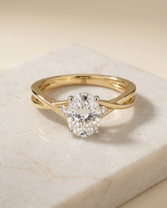 The Dusty Twisted Hidden Halo Solitaire Engagement Ring Setting for Oval Diamonds in 18K Yellow Gold | RockHer