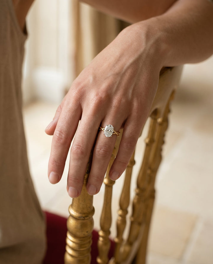 Grace Select Twisted Shank Hidden Halo Solitaire Oval Lab Diamond Engagement Ring in 18K Yellow Gold, lifestyle | RockHer