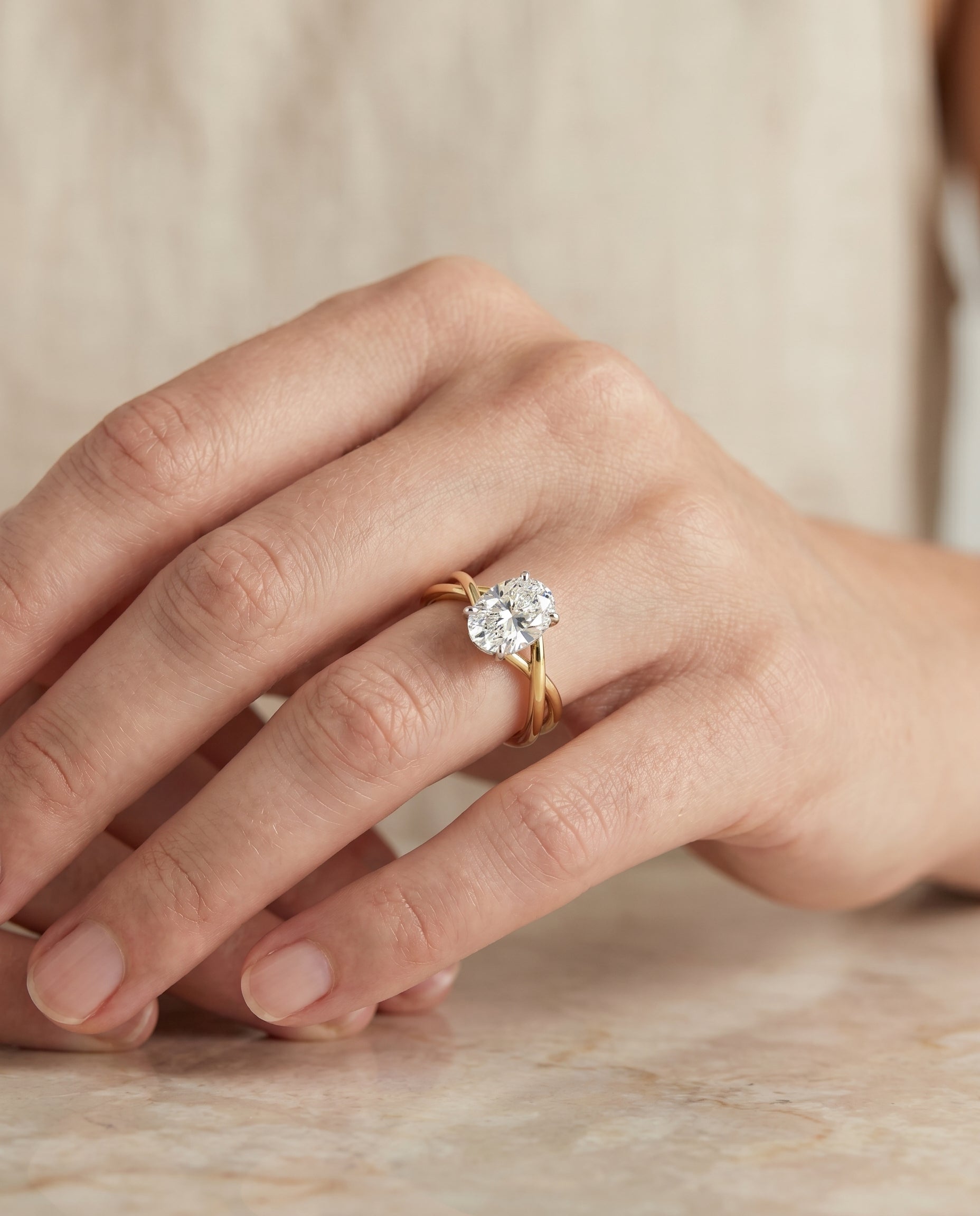 The Grace engagement ring setting in 18K Yellow Gold, twisted shank hidden halo solitaire design | RockHer
