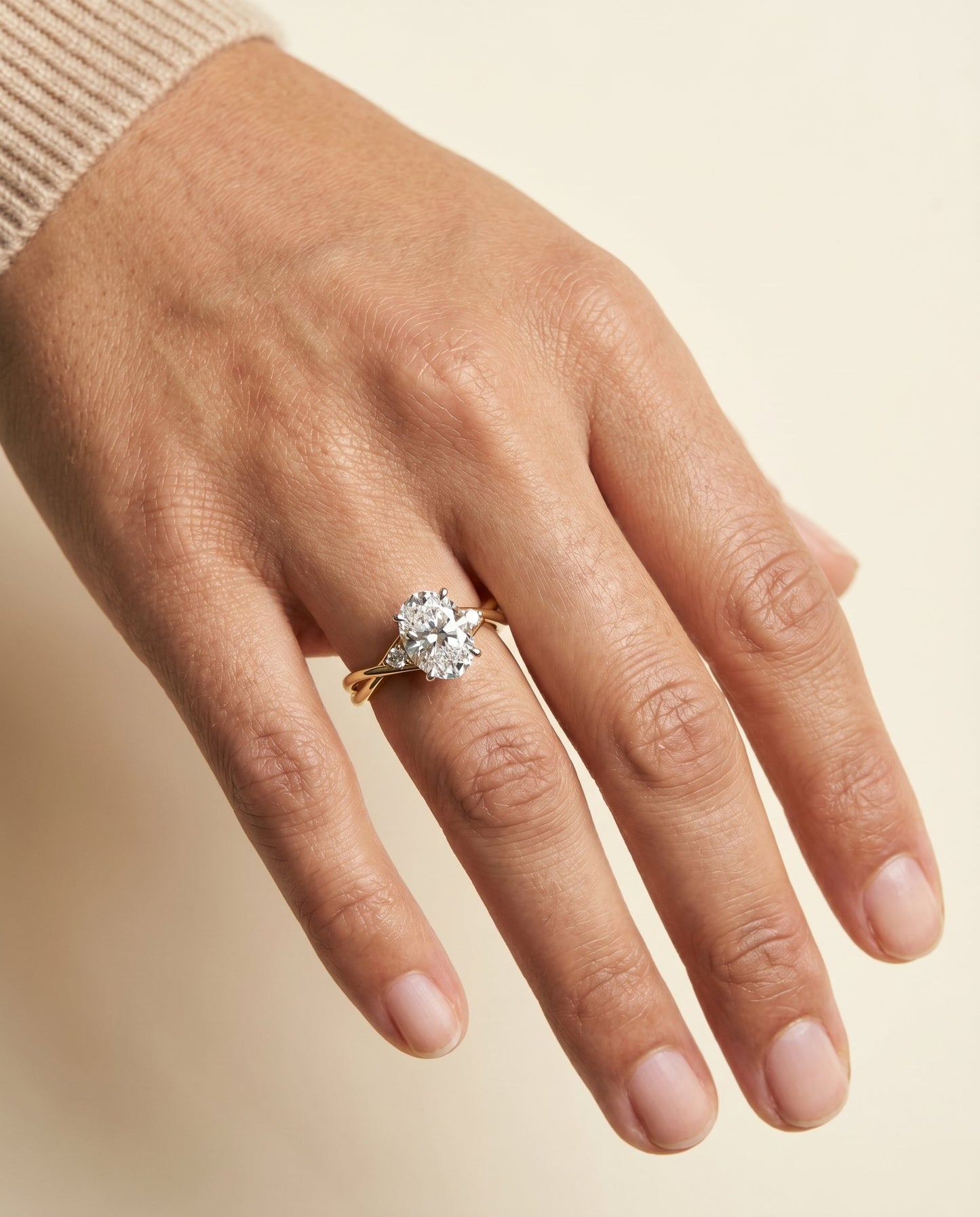 Dusty Select Hidden Halo Solitaire Oval Lab Diamond Engagement Ring in 14K Yellow Gold, shown on hand | RockHer