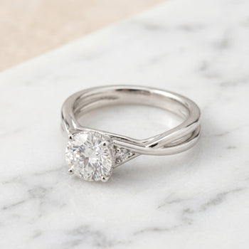 The Dusty Hidden Halo Solitaire Round Engagement Ring Setting in Platinum