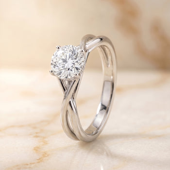 The Grace Twisted Shank Hidden Halo Solitaire Round Engagement Ring Setting in 18K White Gold