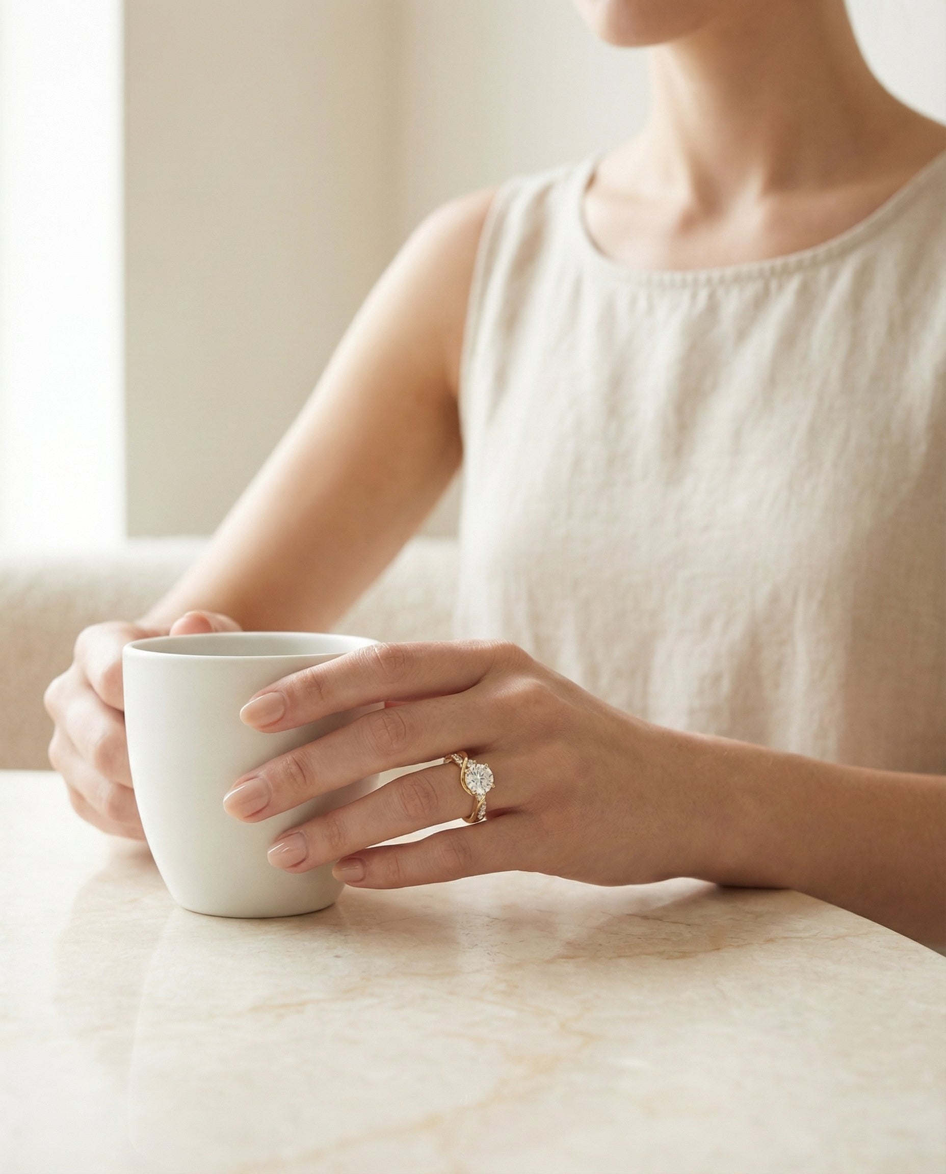 The Alice round setting in 18K Yellow Gold, a twisted three stone design from RockHer