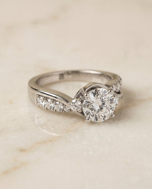 Round Brilliant, Twisted Three Stone, in 18K White Gold – angled view | RockHer
