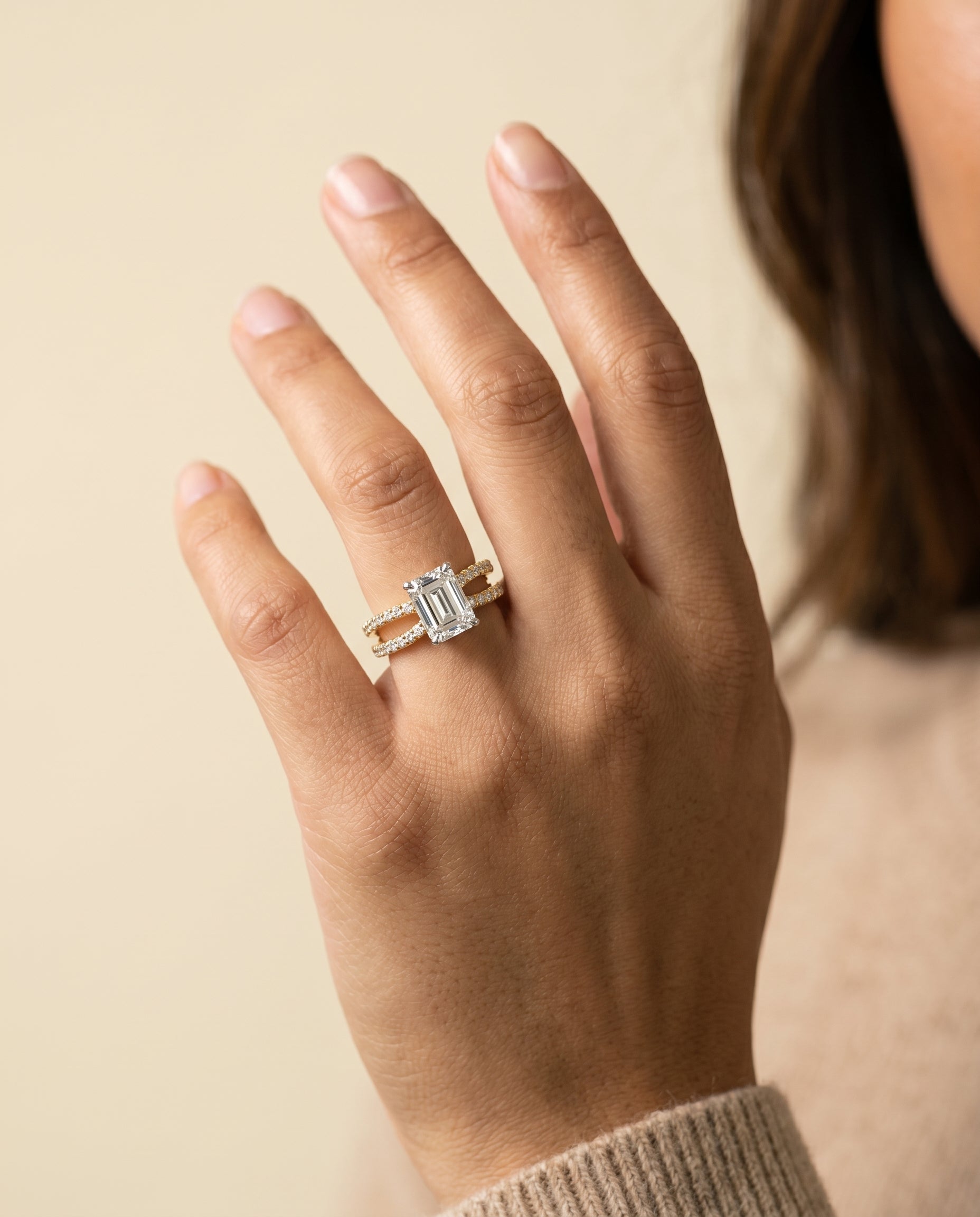 Carole Select Two Row Pavé Split Shank Emerald Cut Lab Diamond Engagement Ring in 18K Yellow Gold, shown on hand | RockHer