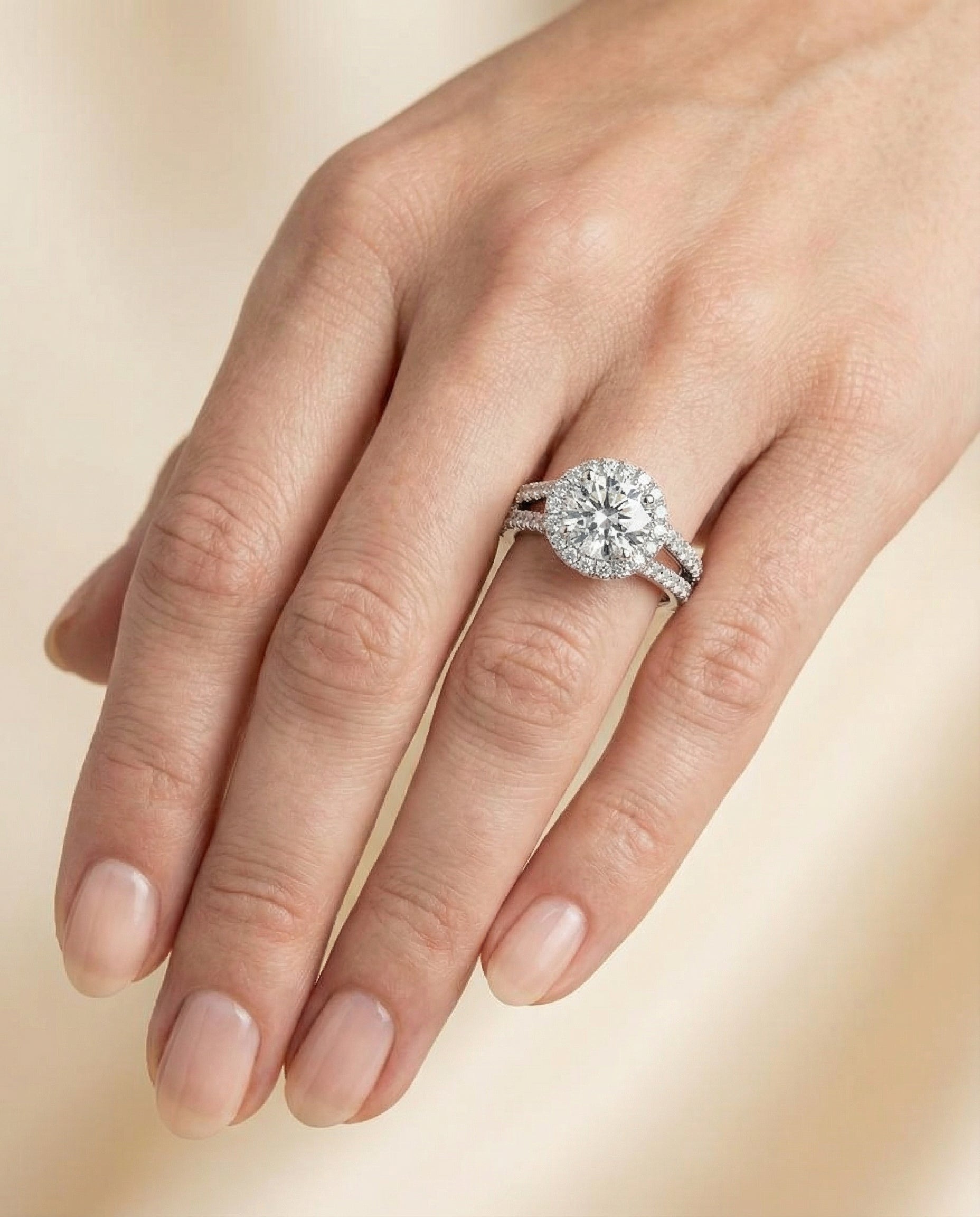Celine Select Pav Halo Split Shank Round Lab Diamond Engagement Ring in Platinum, shown on hand | RockHer