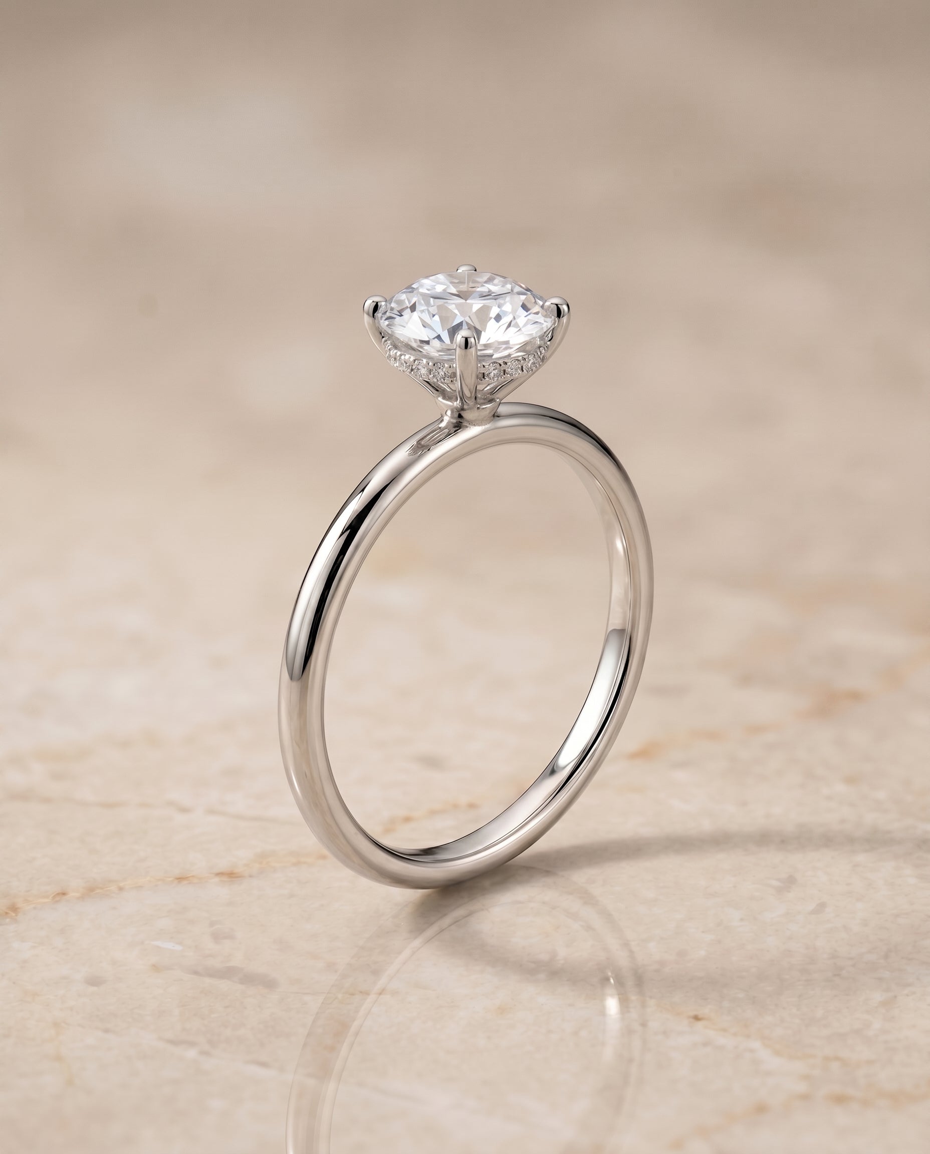 The Eartha upper hidden halo solitaire engagement ring setting, shown in Platinum | RockHer
