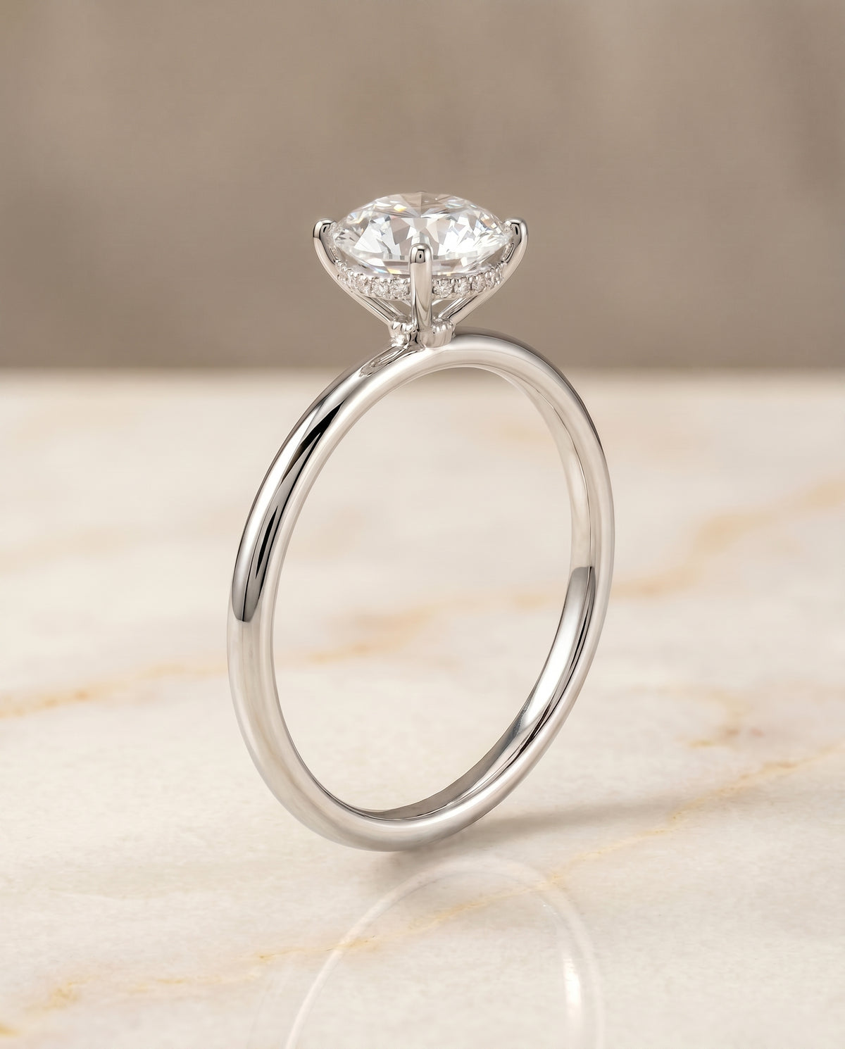 The Eartha upper hidden halo solitaire engagement ring setting, shown in 18K White Gold | RockHer