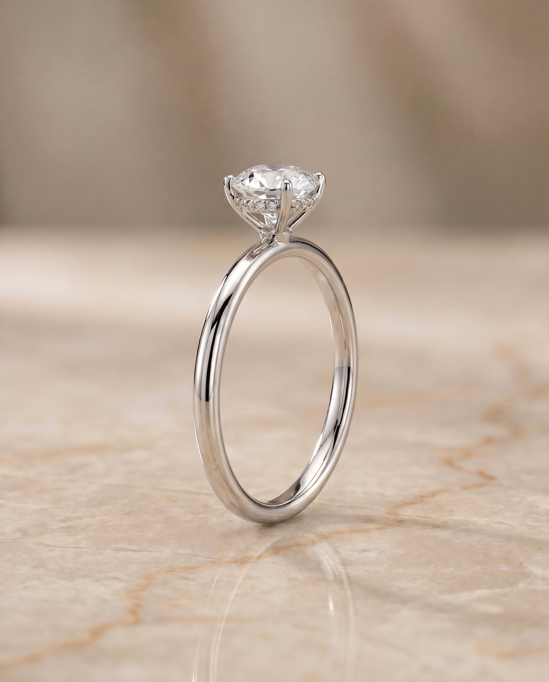 Upper Hidden Halo Solitaire styling on The Eartha round engagement ring setting | RockHer