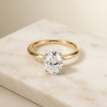The Eartha Upper Hidden Halo Solitaire Oval Engagement Ring Setting in 18K Yellow Gold