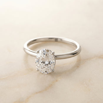 The Eartha Upper Hidden Halo Solitaire Oval Engagement Ring Setting in 18K White Gold