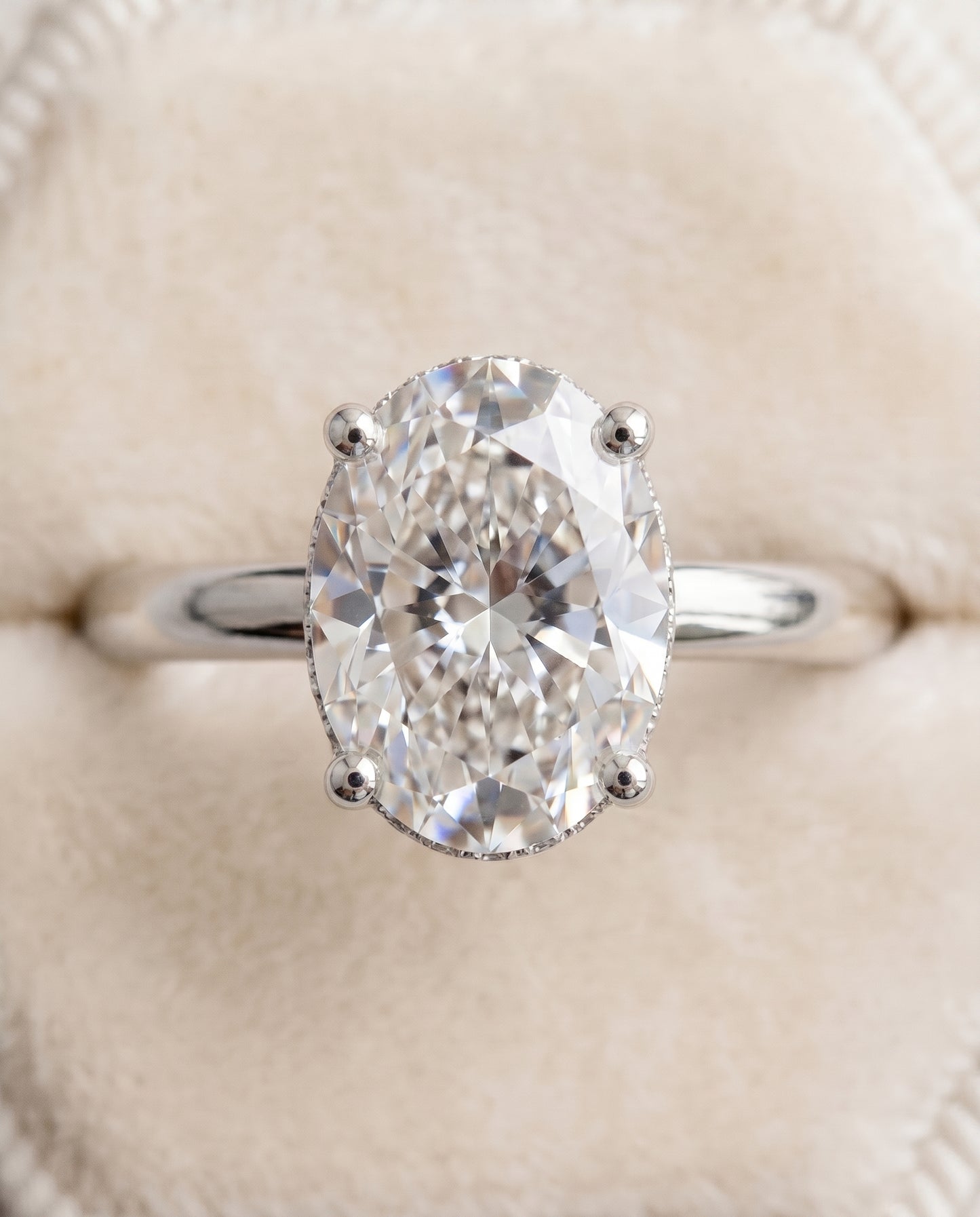 The Eartha Hidden Halo Engagement Ring Setting for Oval Diamonds in 18K White Gold