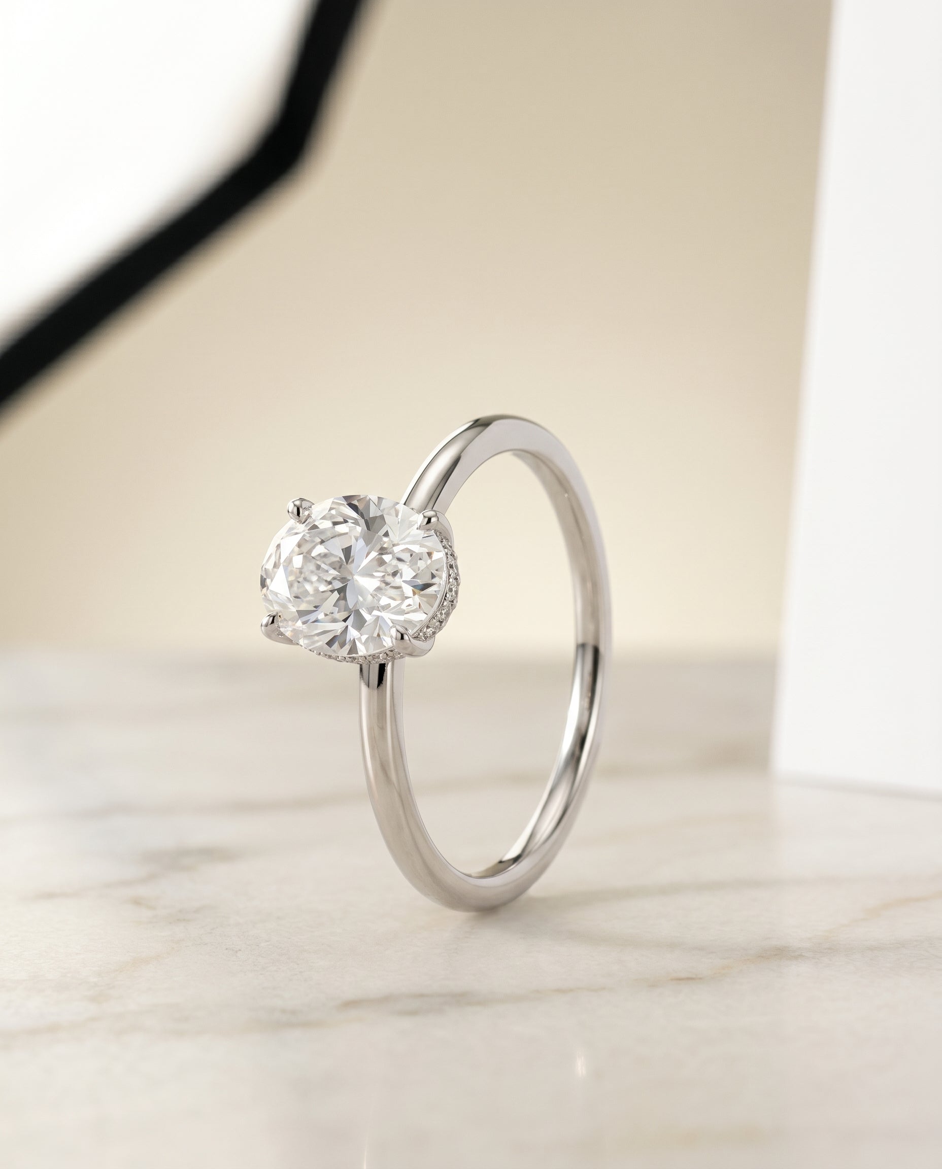 Upper Hidden Halo Solitaire styling on The Eartha oval engagement ring setting | RockHer