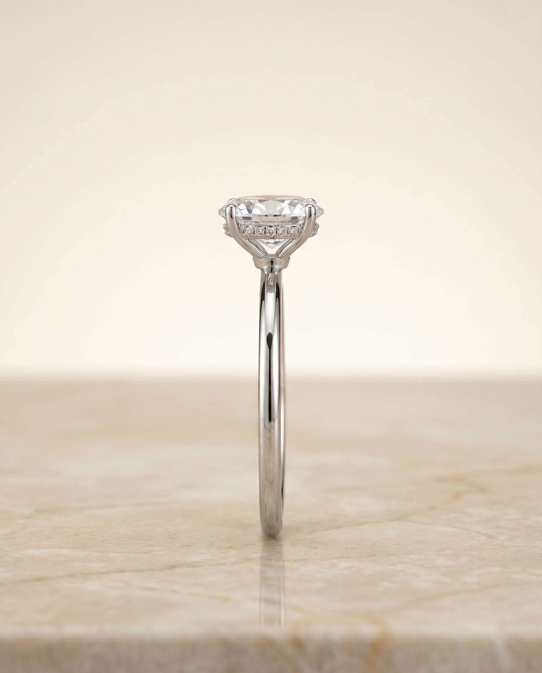 The Eartha upper hidden halo solitaire engagement ring setting, shown in Platinum | RockHer