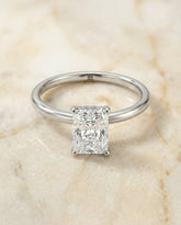 Upper Hidden Halo Solitaire Radiant, in Platinum – angled view | RockHer