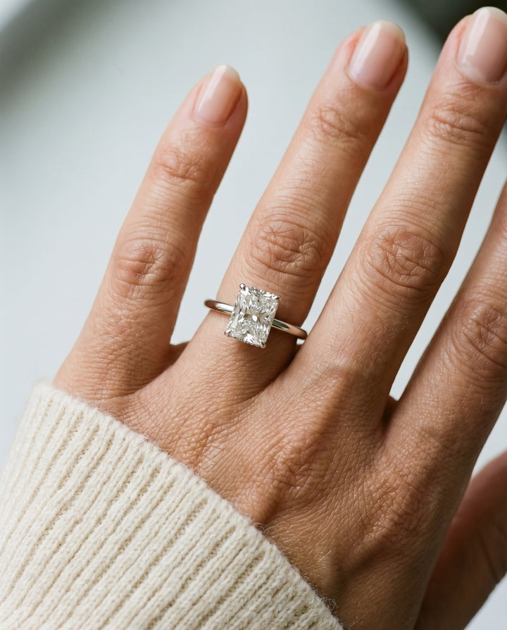 Eartha Select Upper Hidden Halo Solitaire Ra Radiant Cut Lab Diamond Engagement Ring in 18K White Gold, shown on hand | RockHer