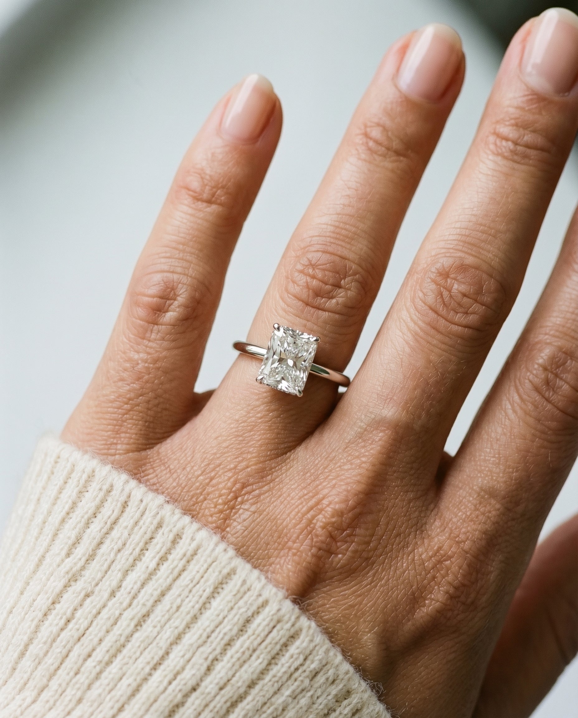 The Eartha upper hidden halo solitaire cut engagement ring setting, shown in 18K White Gold | RockHer